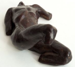 caudal view of a sculpture of a male nude torso lying down