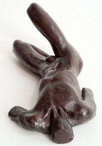 cranial view of a sculpture of a male nude torso lying down