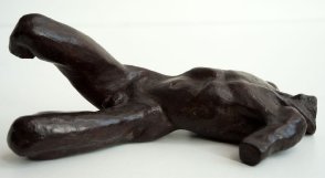 sinister lateral view of a sculputure of a male nude torso lying down