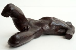 sinister lateral view of a sculputure of a male nude torso lying down