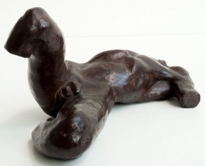 caudal view of a sculputure of a male nude torso lying down