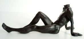 lateral view of a bronze sculpture of a male nude sitting and leaning back on his arms