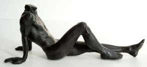 lateral view of a bronze sculpture of a male nude sitting and leaning back on his arms