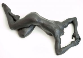 lateral view of bronze sculpture of a female nude lying down