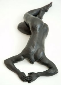 cranial dorsal view of bronze sculpture of a female nude lying down