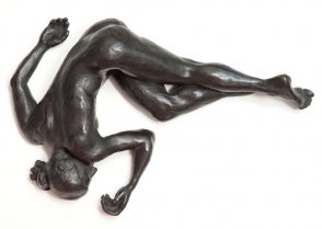 top view of bronze sculpture of a female nude lying down