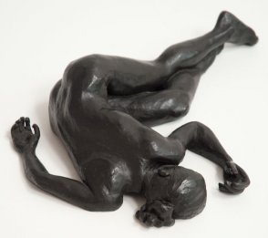 cranial dorsal view of bronze sculpture of a female nude lying down