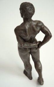 cranial dorsal lateral view of bronze sculpture of male nude standing figure