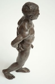 cranial lateral view of bronze sculpture of male nude standing figure