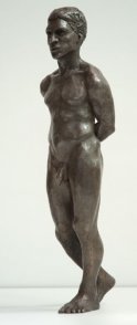 frontal lateral view of bronze sculpture of male nude standing figure