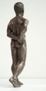 dorsal lateral view of bronze sculpture of male nude standing figure