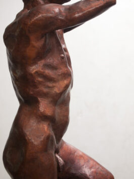 Bronze sculpture of a male nude standing on one leg
