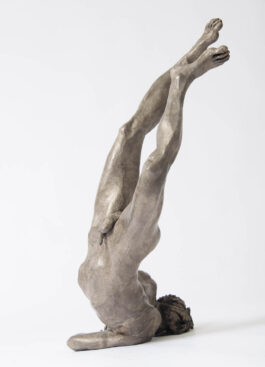 bronze sculpture of Icarus hitting the ground